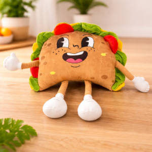 Cute taco plush toy for kids with a smiling face on a wooden table